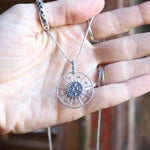 Someone holding the Morgana's Spell Sterling Silver Necklace.