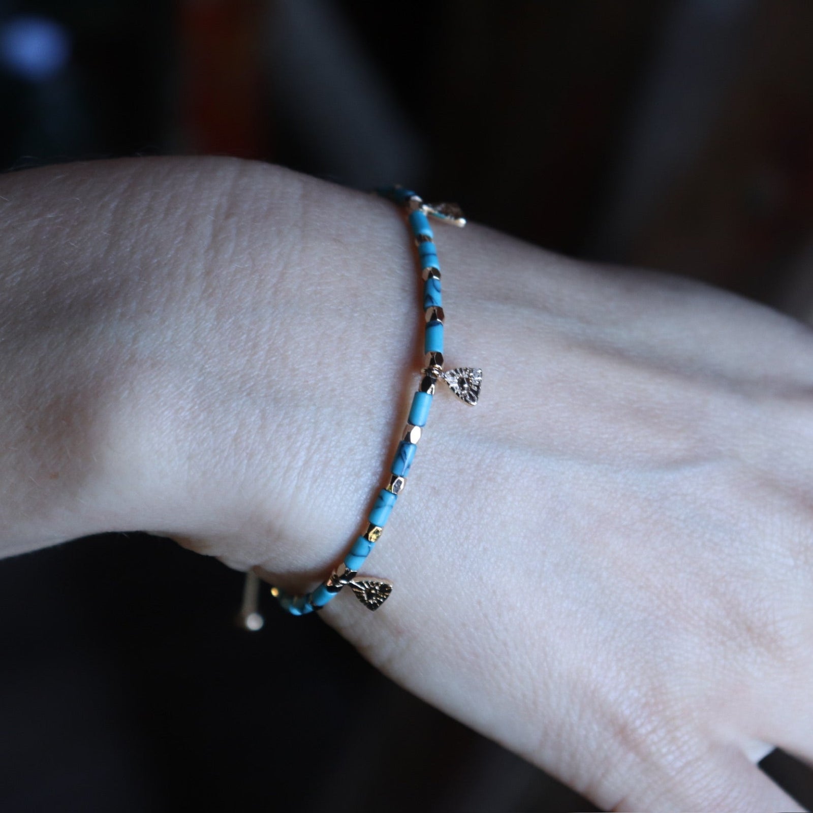 Someone wearing the Temple of Philae Adjustable Bracelet.