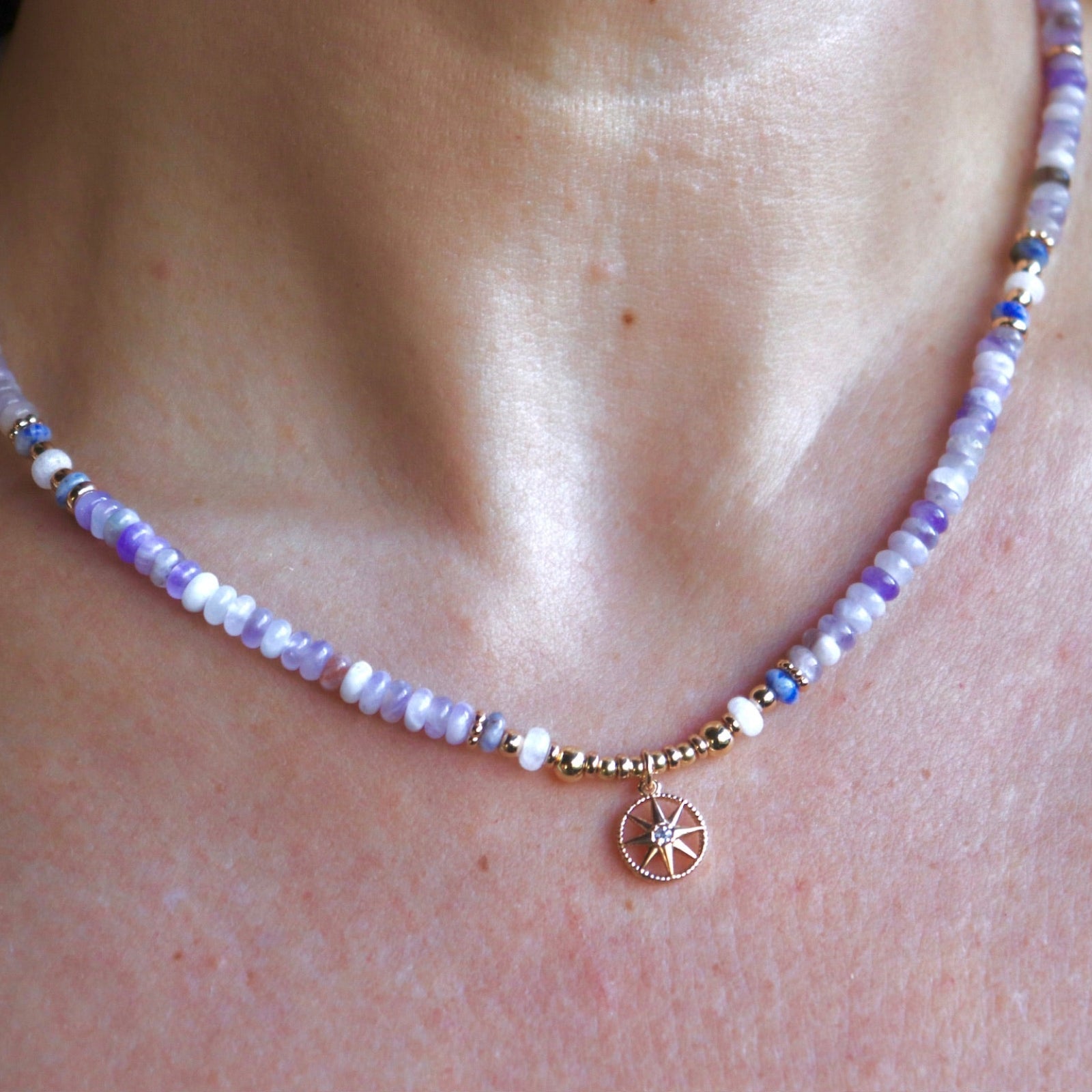 Someone wearing the the Beaded Sea Compass Necklace.