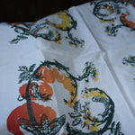 The Tomato Ivory Cotton Bandana laid out showing off the design.