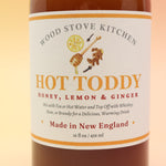 The Hot Toddy Cocktail Mixer and Mocktail Mixer on a pink and yellow background.