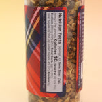 The Mulling Spices bottle on a pink and yellow background.