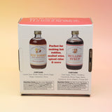 The Winter Survival Gift Set box on a pink and yellow background, showing off the back.