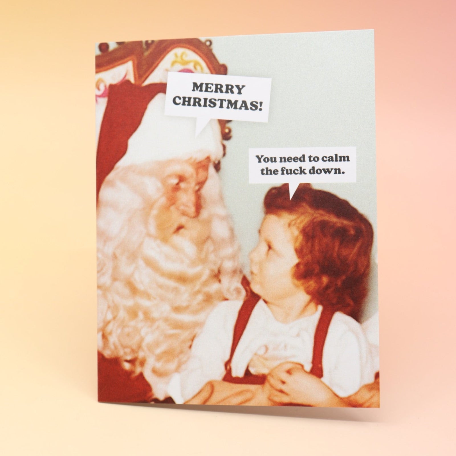 The Calm the F*ck Down Christmas Card on a pink and yellow background.