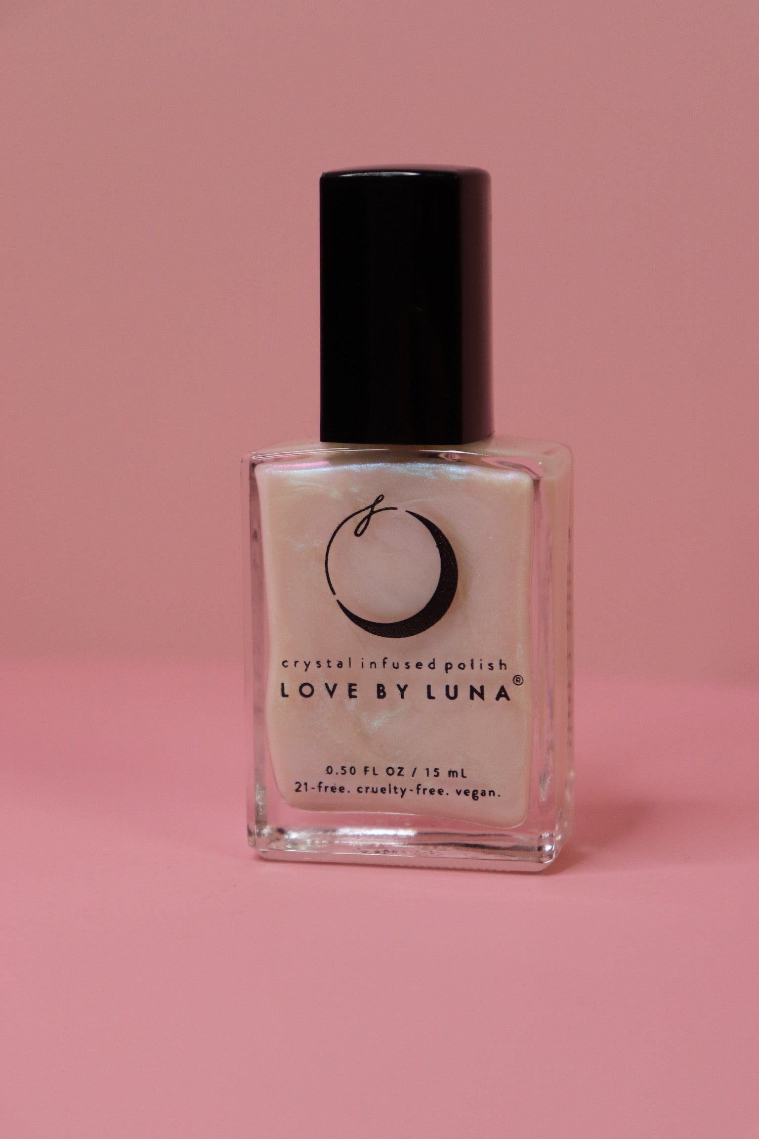 The Full Moon Nail Polish on a pink background.