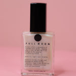 The Full Moon Nail Polish on a pink background.