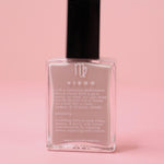 The Virgo Zodiac Nail Polish with Micronized Amazonite on a pink background.