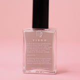 The Virgo Zodiac Nail Polish with Micronized Amazonite on a pink background.