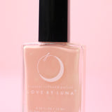 The Taurus Nail Polish on a pink background.