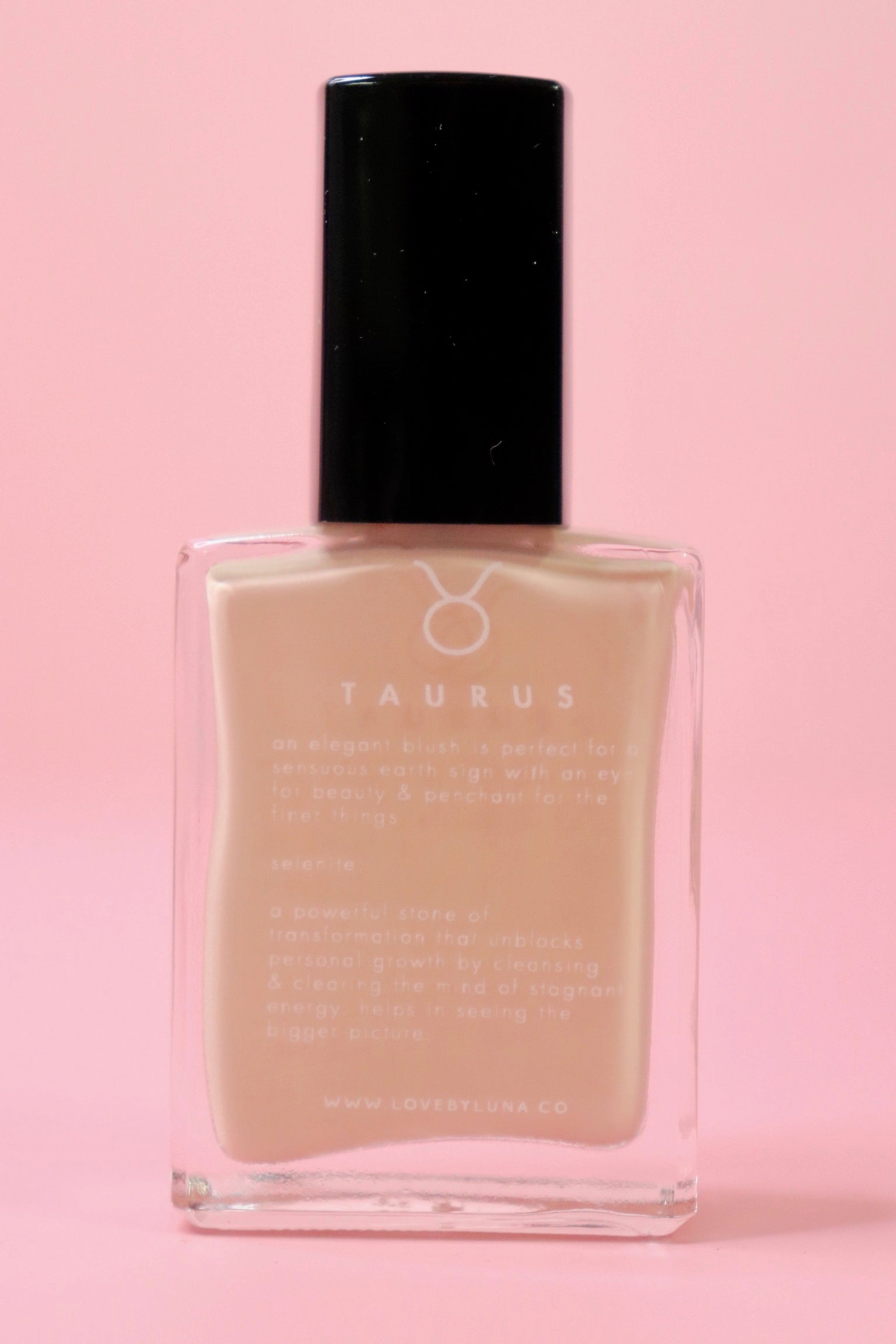 The Taurus Nail Polish on a pink background.
