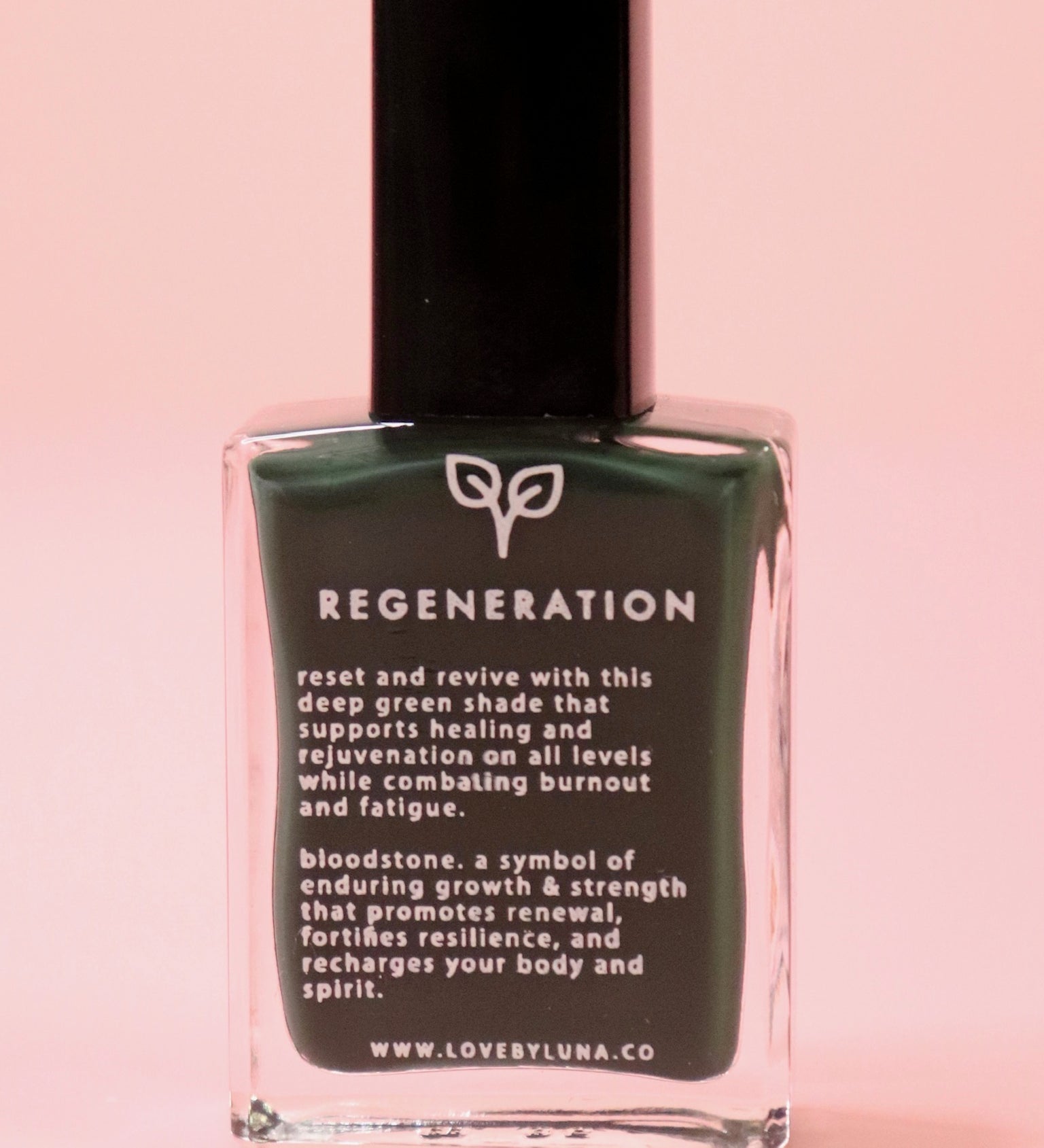 The Regeneration Nail Polish with Micronized Bloodstone on a pink background.