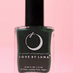 The Regeneration Nail Polish with Micronized Bloodstone on a pink background.