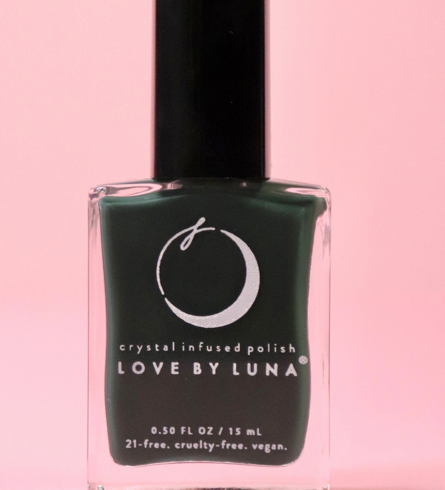 The Regeneration Nail Polish with Micronized Bloodstone on a pink background.