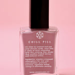 The Chill Pill Nail Polish on a pink background.
