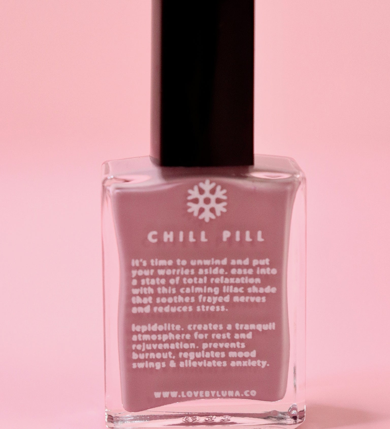 The Chill Pill Nail Polish on a pink background.