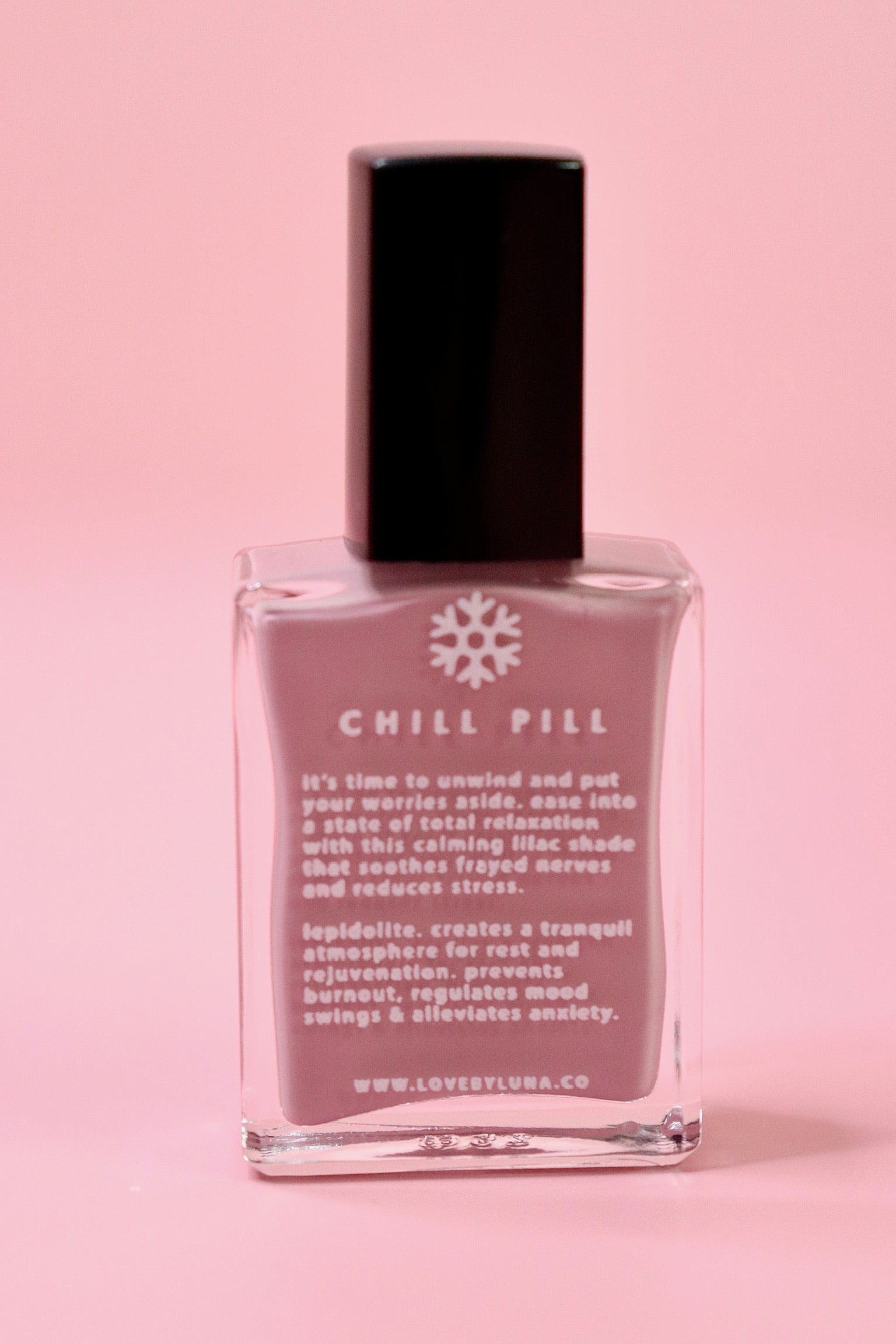 The Chill Pill Nail Polish on a pink background.