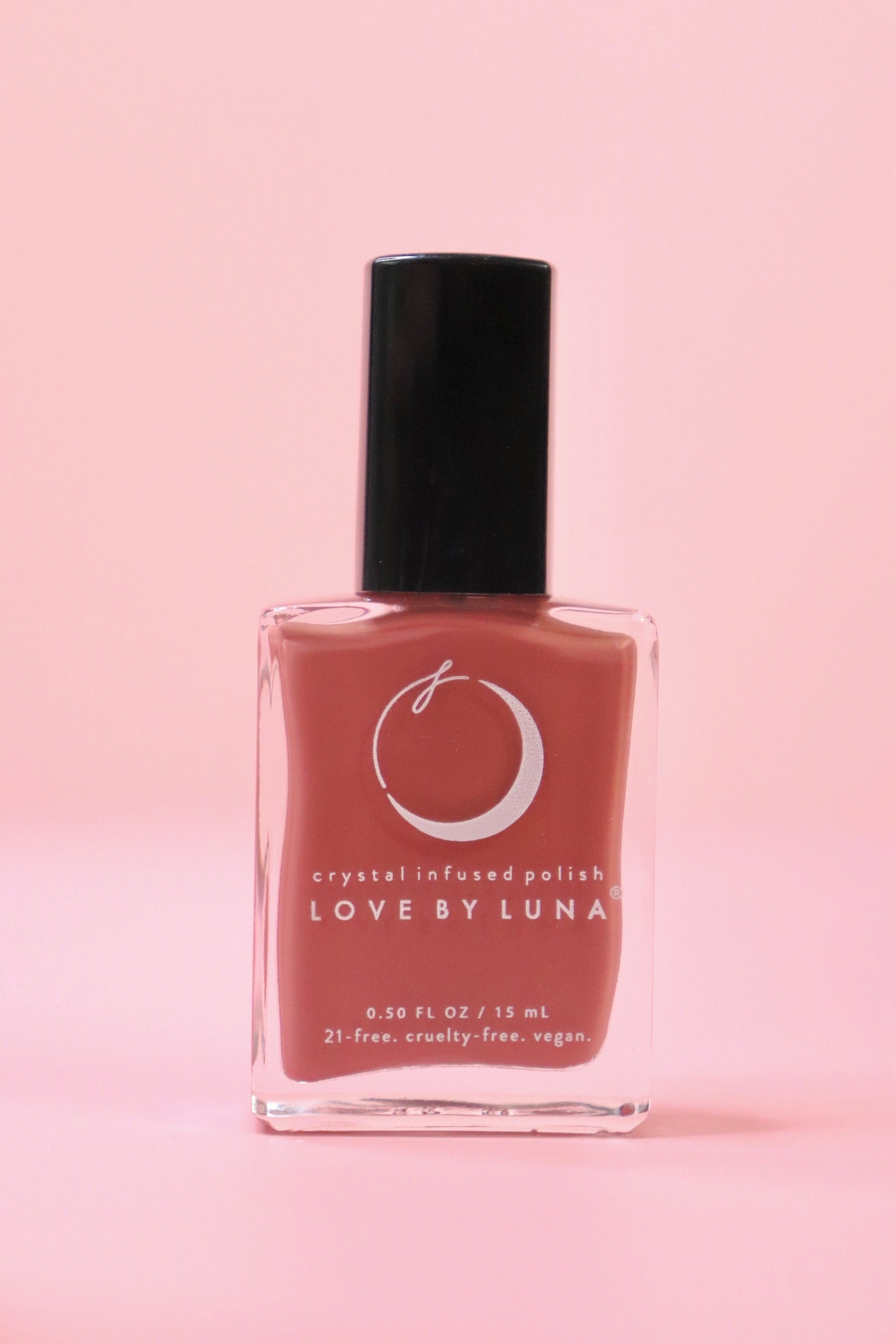 The Wise Warrior Nail Polish with Micronized Tiger's Eye on a pink background.