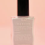 The Cancer Zodiac Nail Polish with Micronized Moonstone on a pink background.