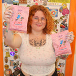 A woman holding the Pippi Longstocking Gold Coins bags.