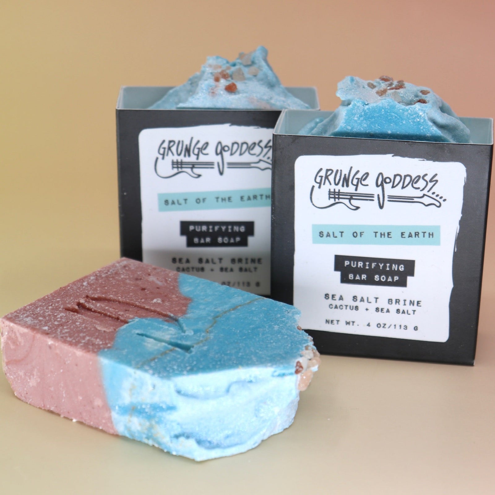 Three of the Purifying Soleseife Bar Soaps on a peach-colored background.