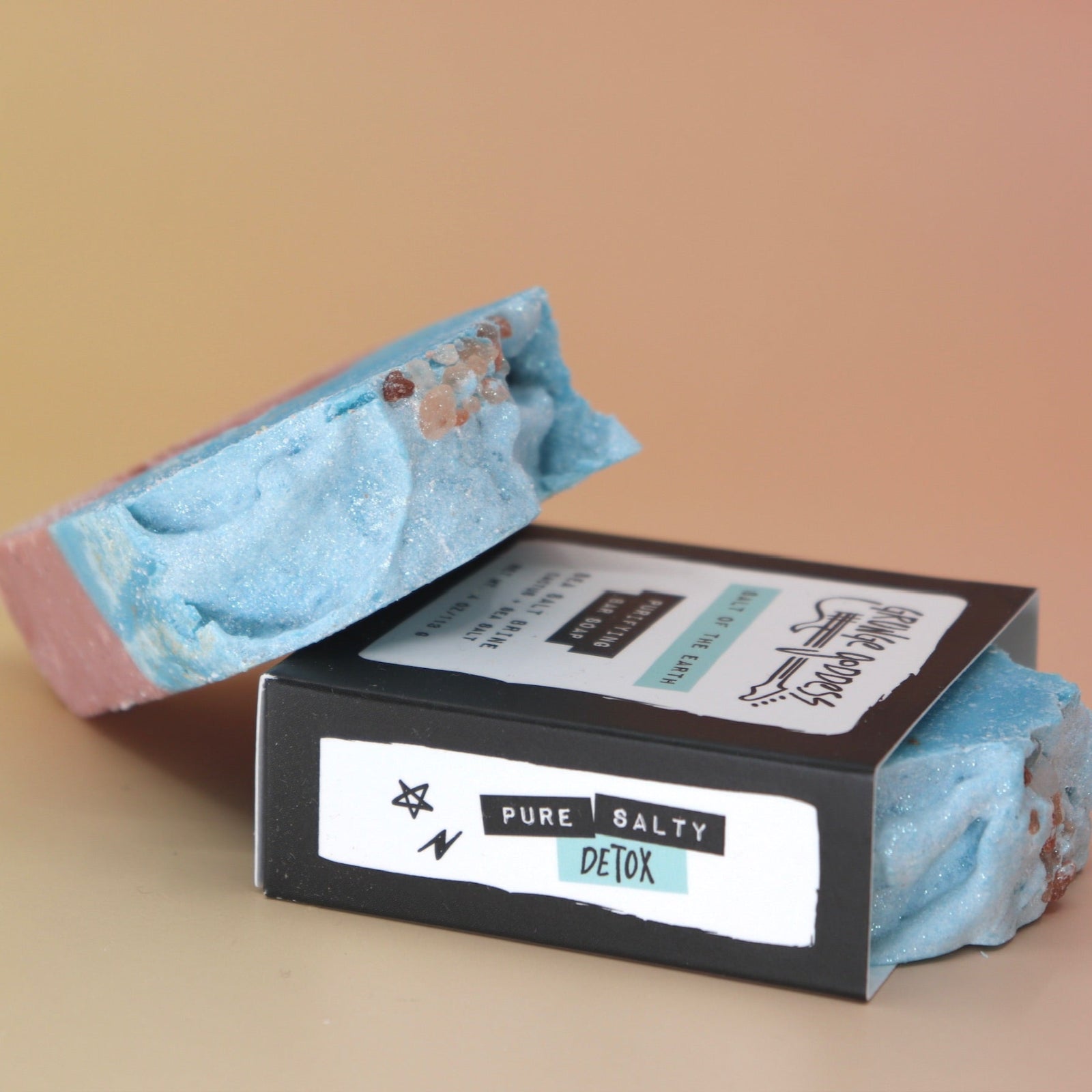 Two of the Purifying Soleseife Bar Soaps on a peach-colored background.