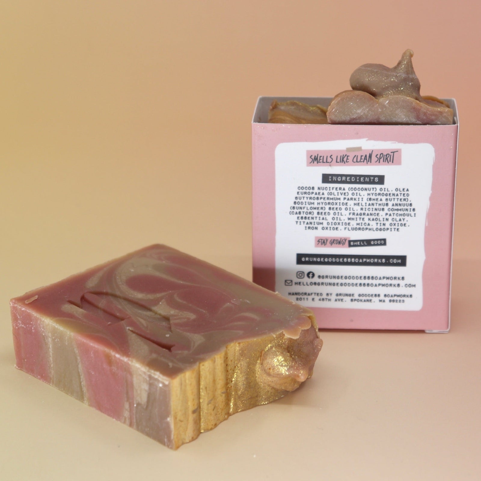 Two of the Riot Grrrl - Moisturizing Bar Soaps on a peach-colored background.
