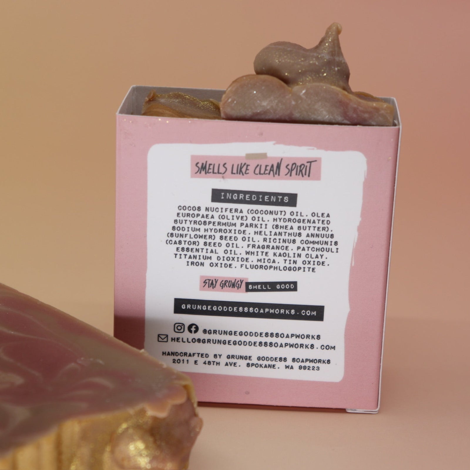 Two of the Riot Grrrl - Moisturizing Bar Soaps on a peach-colored background.