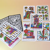 The cards from the Cowgirl Tarot Deck on a pink and yellow background.