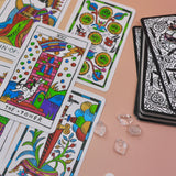 The cards from the Cowgirl Tarot Deck on a pink and yellow background.