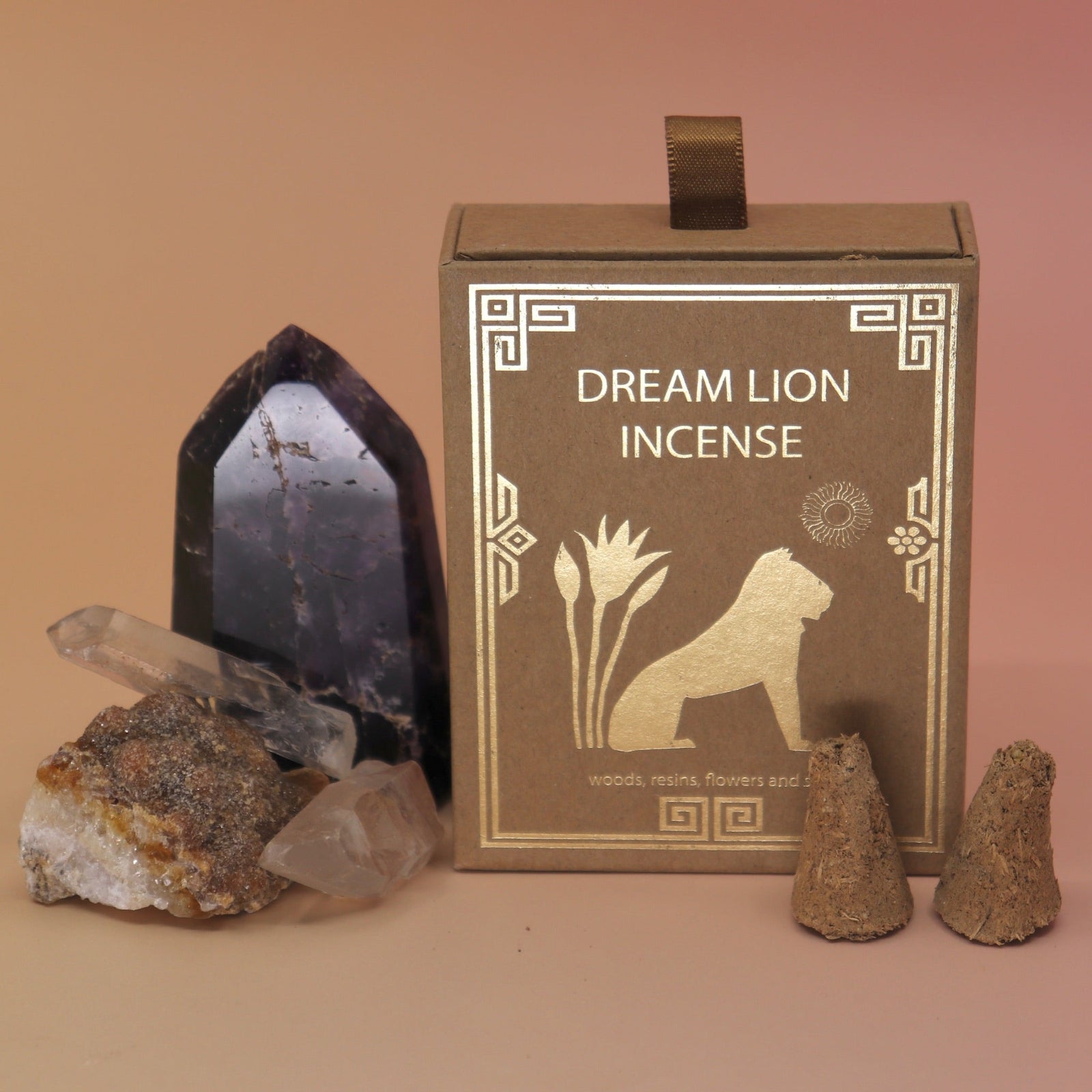 The Creative Imagination Incense Cones box next to two crystal pieces next to it with two incense cones in front of it.