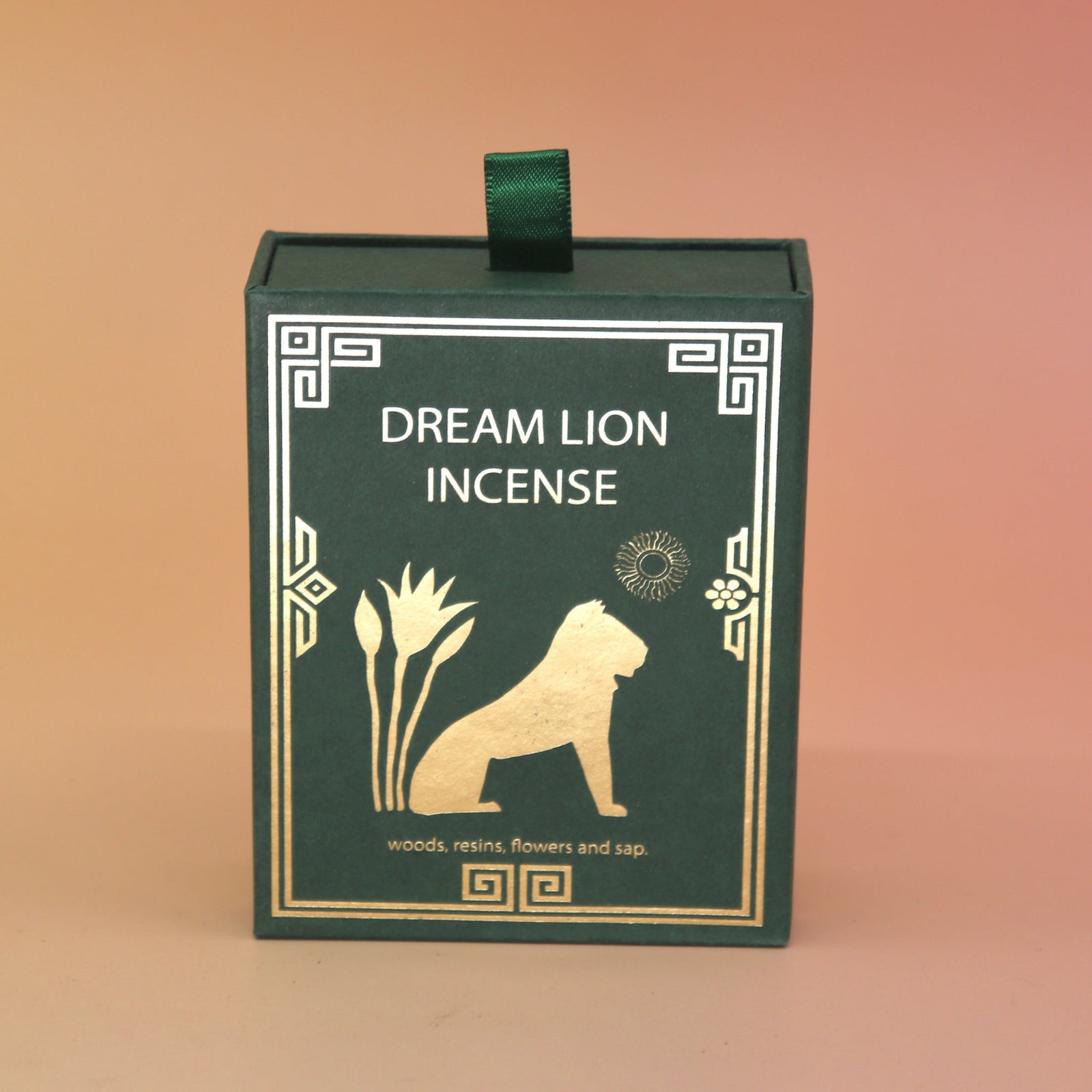 The Mayan Copal + Desert Sage Incense Cone box on a pink and yellow background.