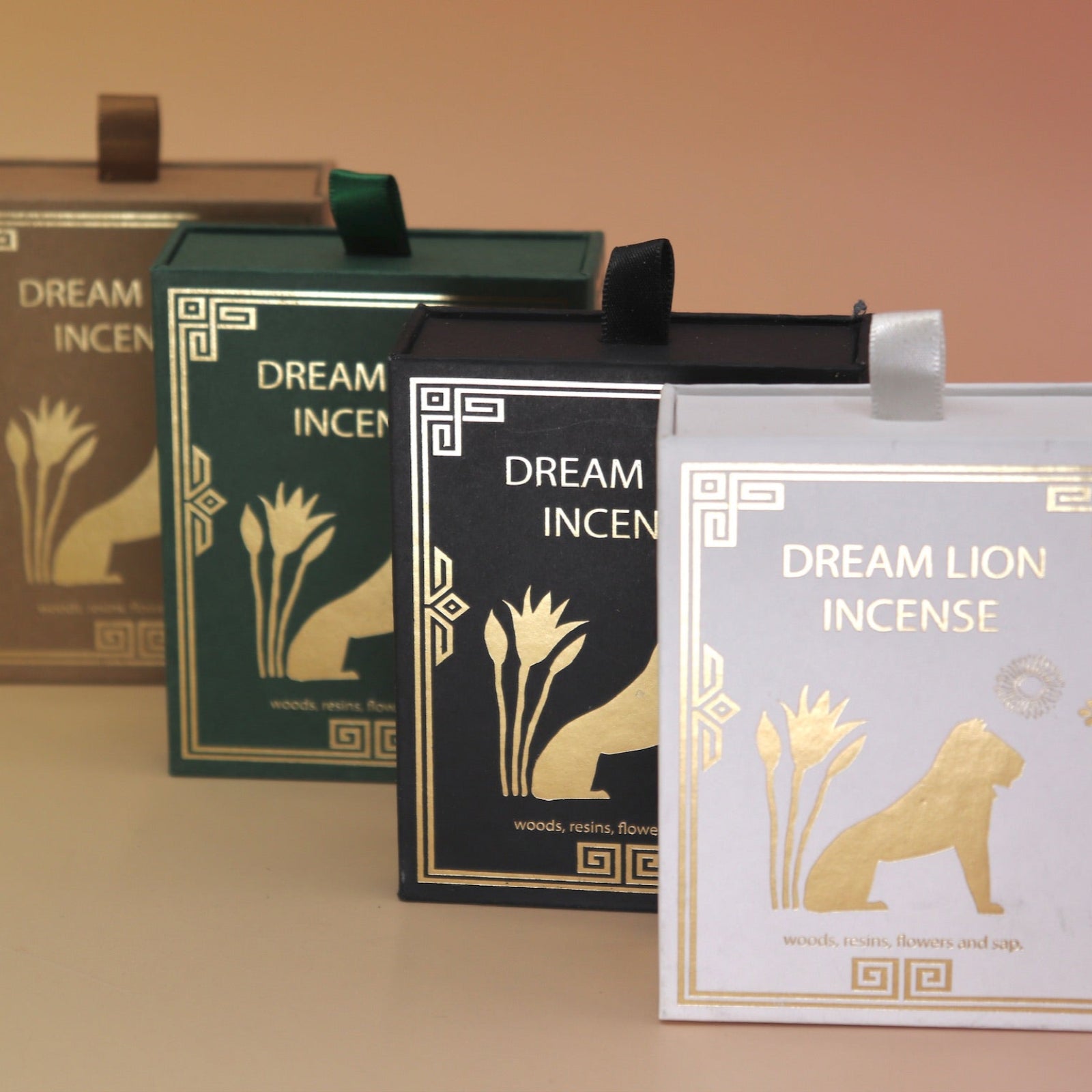 All of the Dream Lion incense on a pink and yellow background.