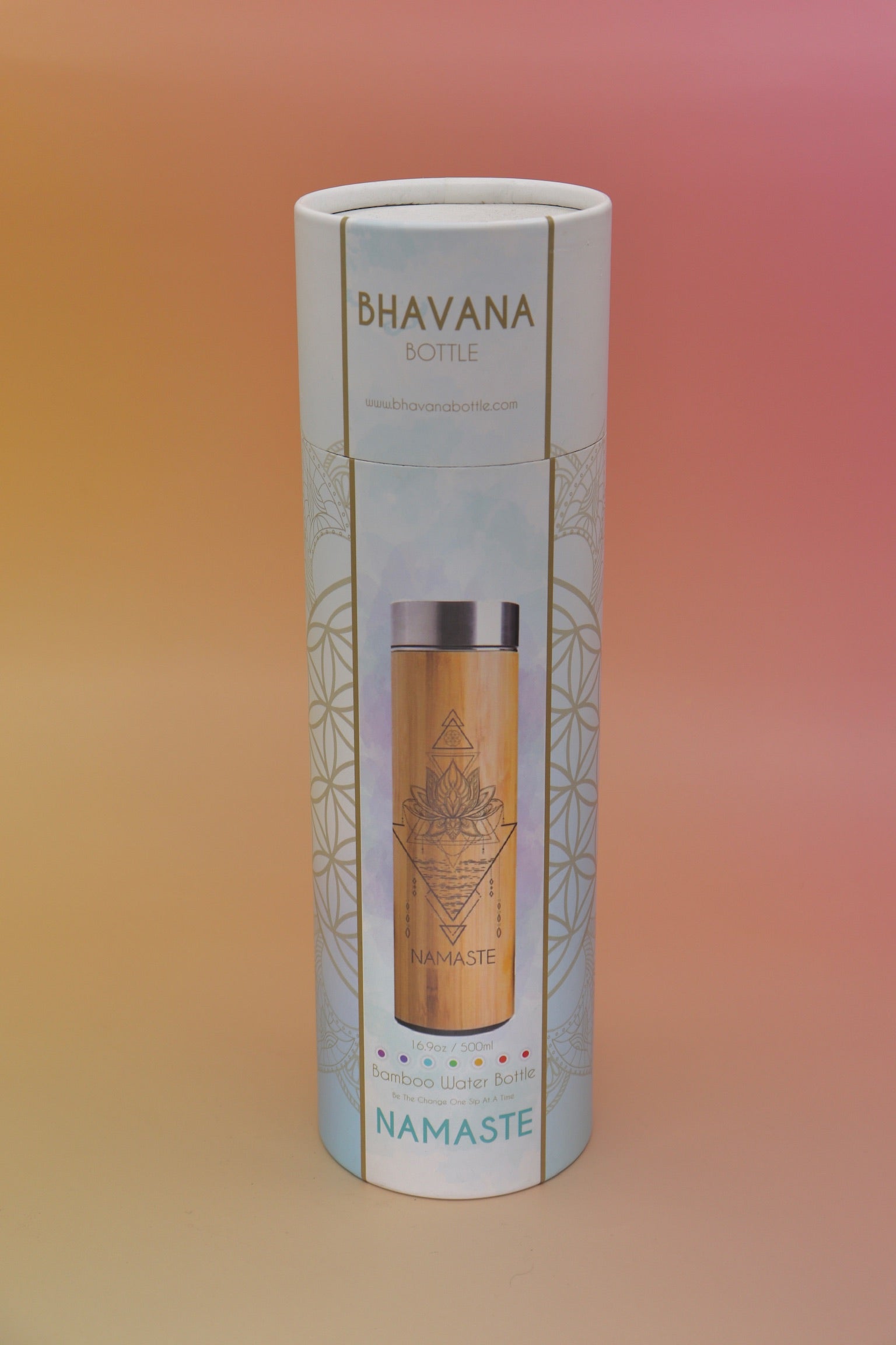 The Bhavana Bamboo Infuser Traveler Tumbler container on a pink and yellow background.