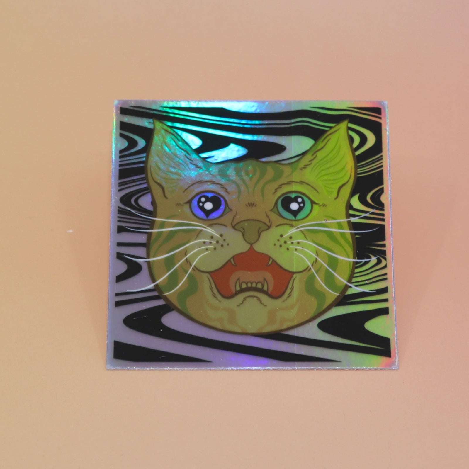 The Cozmik Love Cat 3" Holographic Vinyl Sticker on a light pink background.