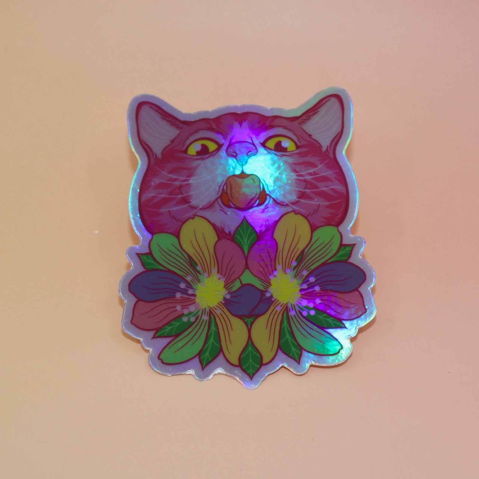 The Sapphic Flower Kitty 4" Holographic Vinyl Sticker on a light pink background.
