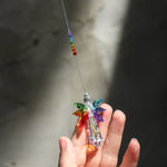 Someone holding the Crystal Chakra Guardian Angel in the light.