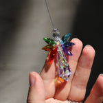 Someone holding the Crystal Chakra Guardian Angel in the light.
