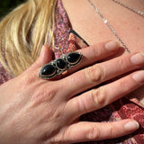 Someone wearing the Three Stone Black Onyx Sterling Silver Adjustable Ring.