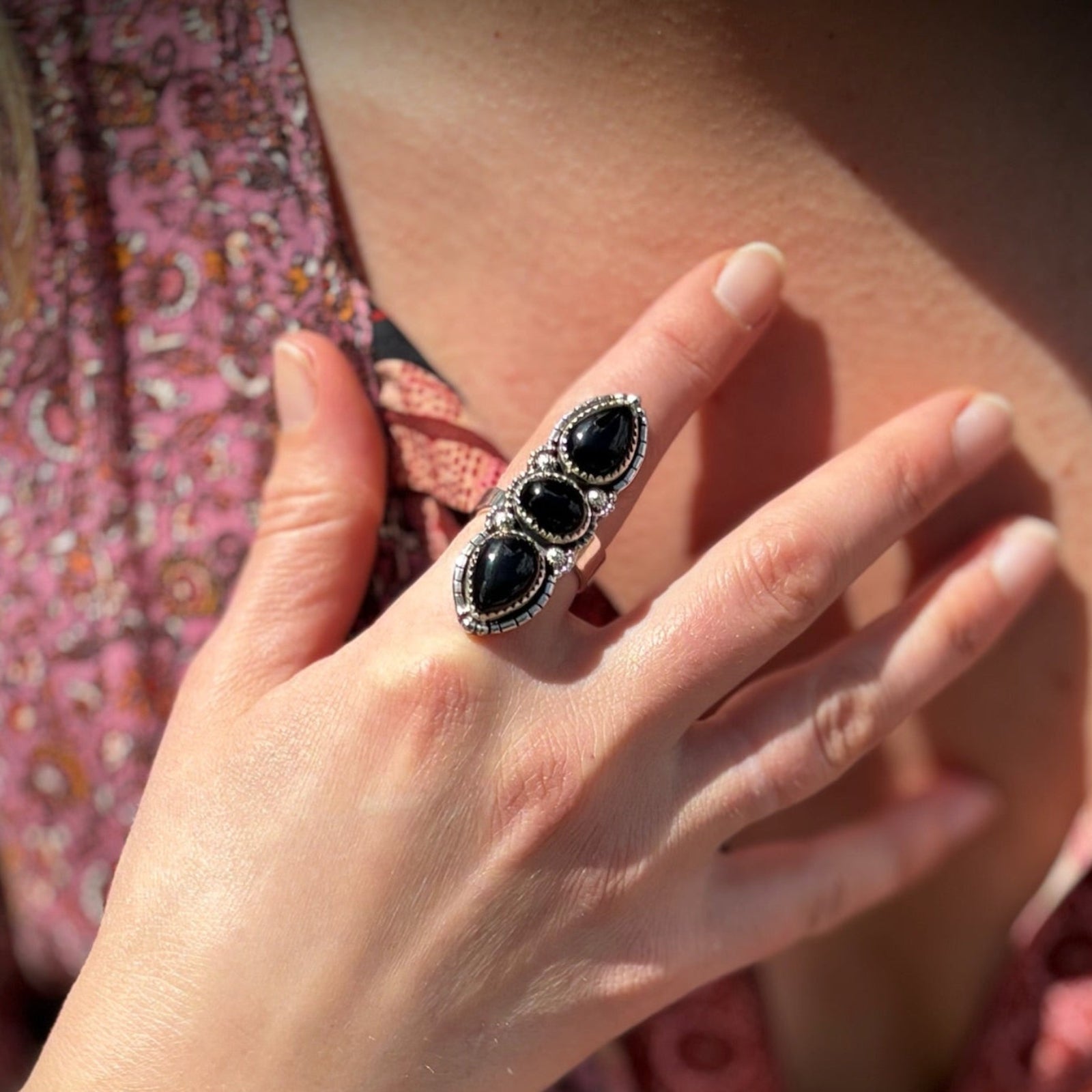 Someone wearing the Three Stone Black Onyx Sterling Silver Adjustable Ring.