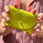 Someone holding the Chartreuse Leather Cardholder.