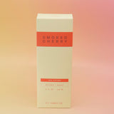 The Smoked Cherry – HI-FI Reed Diffuser box on a pink and yellow background.