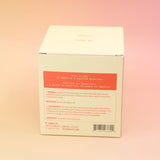 The back of the Plush Vetiver - HI-FI Soy Wax Candle box on a pink and yellow background.