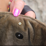 Someone holding the Geometric Rust Mud Cloth Tote with Pink Faux Fur open to show the inside.