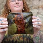 Someone holding the Snake Print Mini Coin Card Pouch.
