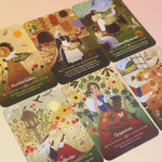 The Lammas Oracle Cards on a pink and yellow background.