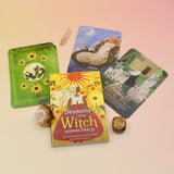 The Lammas Oracle Cards and guidebook on a pink and yellow background.