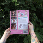 Someone holding the Chappell Roan Coloring & Activity Book in front of greenery, showing off the back of the book.
