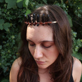A woman wearing the Fairy Crown / Celtic Tiara - Smoky Quartz in front of greenery.