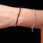 Someone wearing the Dainty and Elegant Multi-Faceted Garnet Beads + Copper Bracelet.