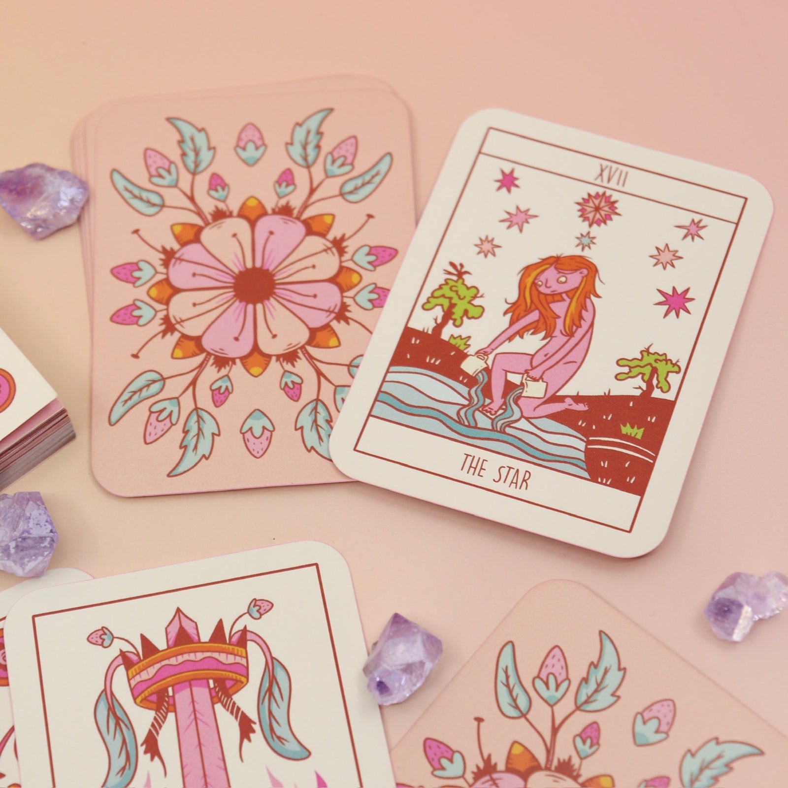 The contents of the Squid Cake Marseille Tarot Deck all on a pink and yellow background.